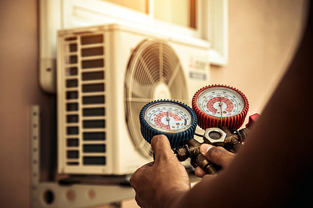 Professional Air Conditioning Service technician working in Hudsonville, MI